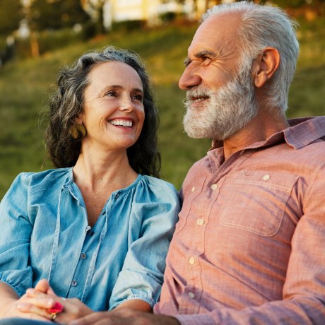 Older Man and woman on bench, smiling