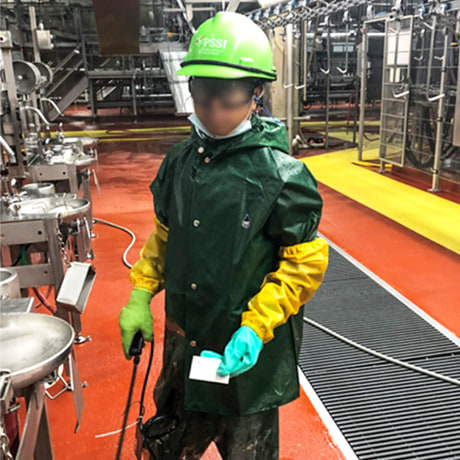 A Department of Labor investigator photographed a child who worked for Packers Sanitation Services Inc. (PSSI) cleaning a slaughterhouse in Grand Island, Nebraska. The subject has been blurred by the source.