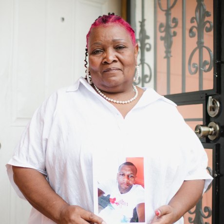 Image: Bettersten Wade holds a photo of her son, Dexter.