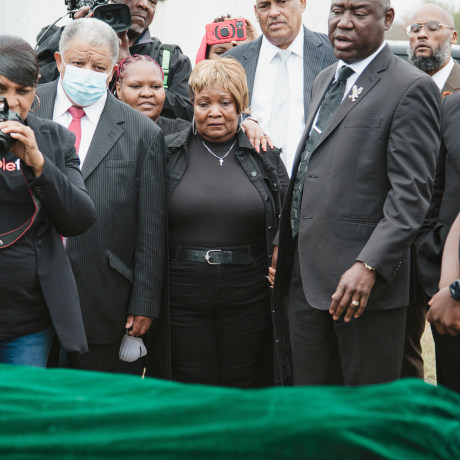 Dexter Wade's mother, Bettersten Wade, looks on as his body is exhumed from a field at the Hinds County jail's penal farm.