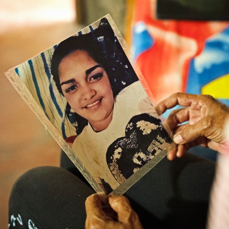 Aurimar Iturriago Villegas's mother looks at her photo at her home in Venezuela.