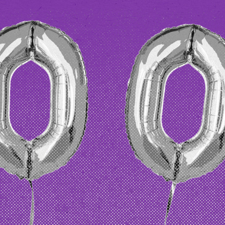 Balloons that spell the number 100, against a purple background.