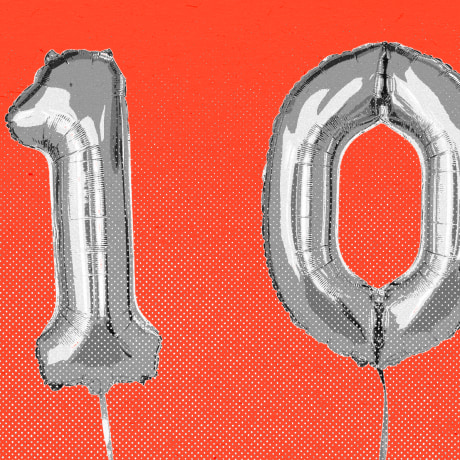 Balloons that spell the number 100, against a red background.