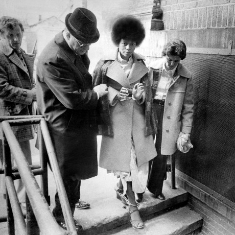 In a caravan of eight cars bearing heavily armed state polic