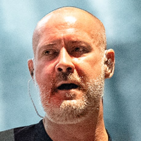 Sam Rivers plays guitar on stage