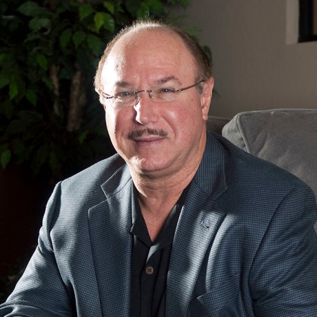 Victor Conte, owner of BALCO lab, sits behind a table of his supplements in Burlingame, Calif., in 2010.
