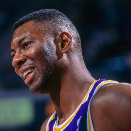 Elden Campbell of the Los Angeles Lakers smiles on the court.