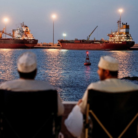 Galaxy Globe bulk carrier and Luojiashan tanker sit anchored in Muscat
