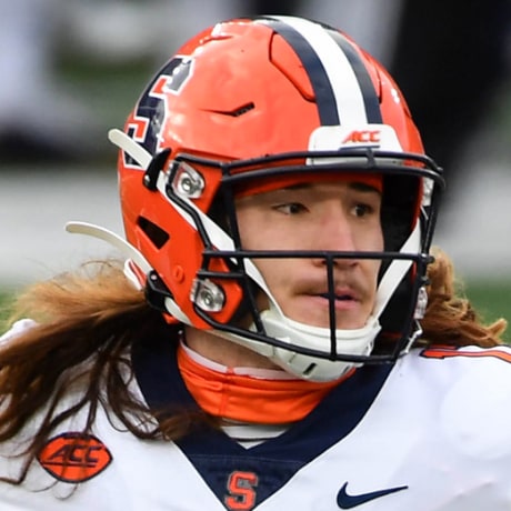 Rex Culpepper on the football field preparing to throw a football