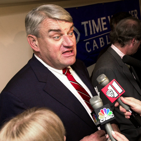 Joseph Collins discusses his company a news conference.
