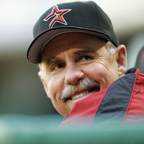 Phil Garner smiles while wearing a Houston Astros hat.