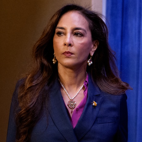 Harmeet Dhillon arrives for a news conference at the Justice Department.