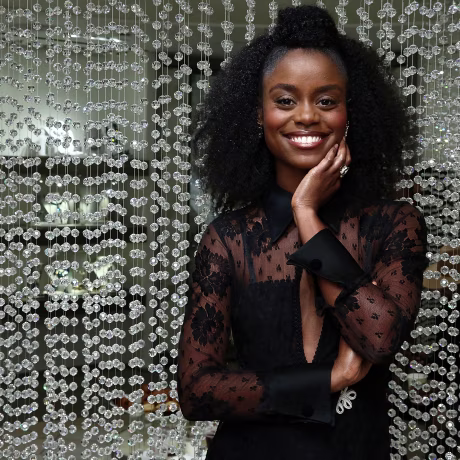 Actress Denee Benton poses for photos in the Swarovski Store before the Swarovski Star Raising at Rockefeller Center Christmas Tree.