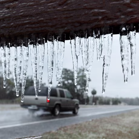Image: Icicles hang from a sign in Hilliard, Florida