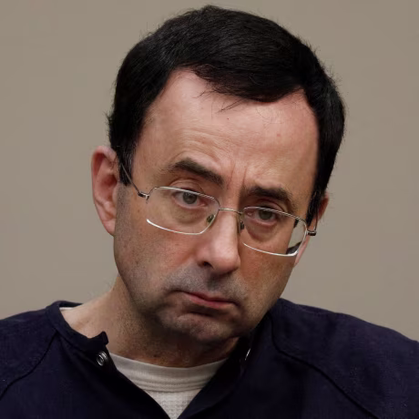 Image: Larry Nassar, a former team USA Gymnastics doctor who pleaded guilty in November 2017 to sexual assault charges, sits in the courtroom during his sentencing hearing in Lansing, Michigan