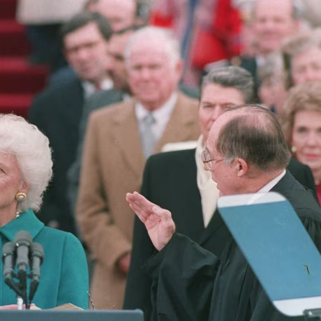 Image: First lady Barbara Bush holds the bible for her husband George Bush as he is sworn into office