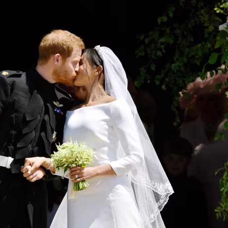 Image: Prince Harry and Meghan Markle kiss on the steps of St George's Chapel