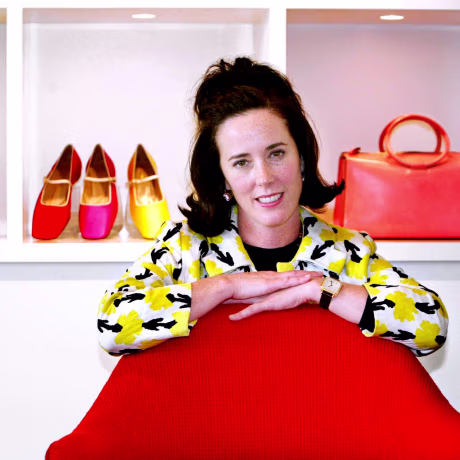 Image: Designer Kate Spade poses with handbags and shoes