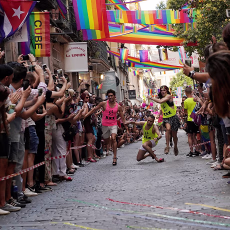 Image: Contestants take part in the annual race on high heels during gay pride celebrations in the quarter of Chueca in Madrid