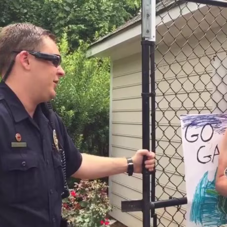 Adam Bloom talks to police at a pool in Winston-Salem, North Carolina.