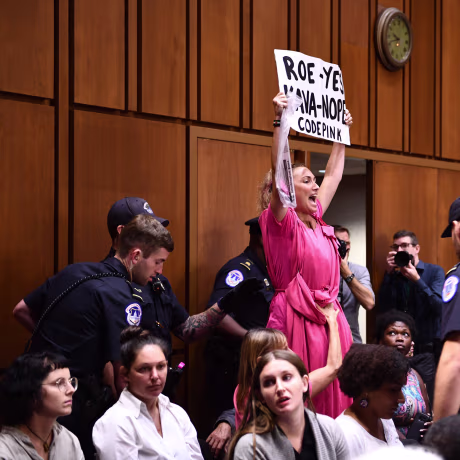 Image: A member of Code Pink protests as Supreme Court nominee Brett Kavanaugh arrives