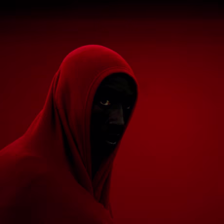 Image: A migrant, part of a group intercepted off the coast in the Mediterranean Sea, stands in a queue after arriving on a rescue boat at the port of Motril