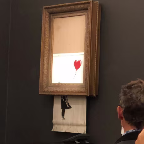 The canvas work depicting a girl reaching toward a red heart-shaped balloon is one of Banksy's best-known pieces.