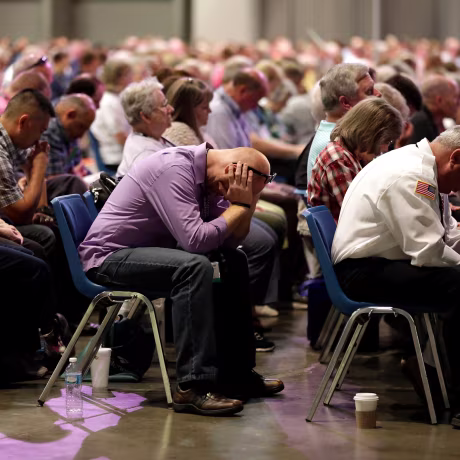 Image: People pray during the annual meeting of the Southern Baptist Convention on June 14, 2016, in St. Louis.