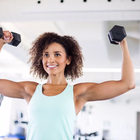 Image: Young Woman Weightraining at the Gym