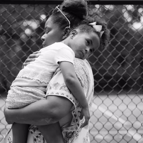 Ajshay James holds her daughter, Harper, at the end of a visit in July 2019.
