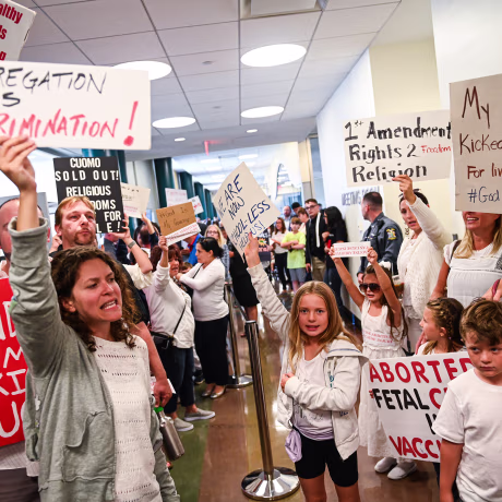 Anti-vaccine protestors outside meeting with New York State Gov. Andrew Cuomo
