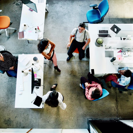 Overhead view of design team having project meeting in office