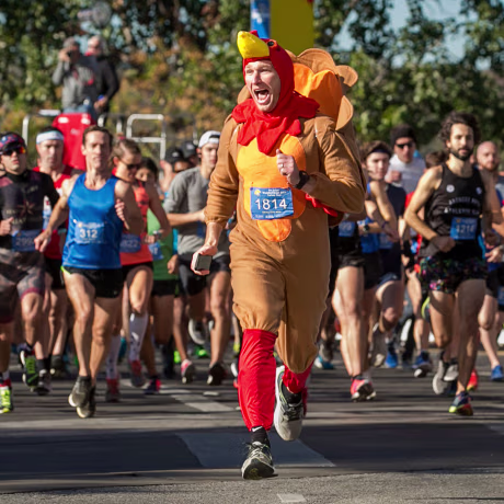 Chris Conlan leads the runners at the start of the 27th annual ThunderCloud Subs Turkey Trot in downtown Austin, Texas, on Nov. 23, 2017.