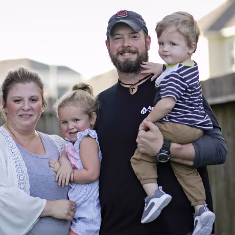 Melissa and Dillon Bright with their children, Charlotte and Mason, outside their Tomball, Texas home.