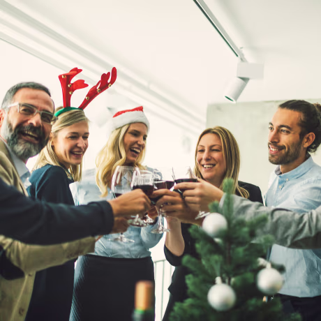 Image: Business people toasting with red wine at workplace