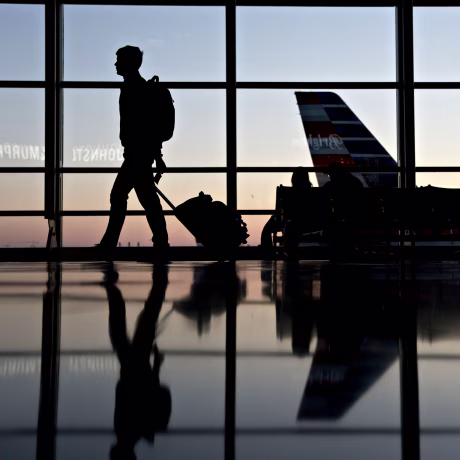 Image: Travelers walk through Ronald Reagan National Airport in Washington on Nov. 21, 2018.