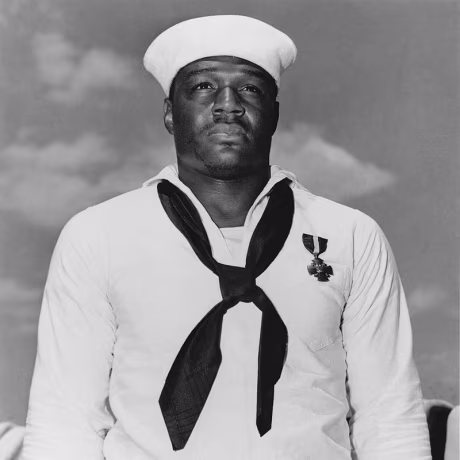 Doris Miller, who was the first African-American sailor to receive the Navy Cross for his bravery during the Japanese attack on Pearl Harbor.