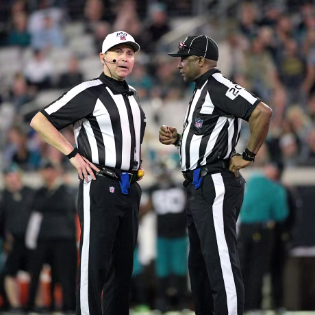 Referee Brad Allen, left, and umpire Barry Anderson (20) talk on the field during the second half of an NFL football game against the Indianapolis Colts on Dec. 29, 2019, in Jacksonville, Fla. Umpire Anderson will be part of the Super Bowl officiating bcrew.
