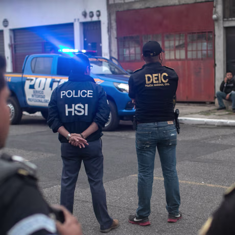 Agents from ICE, Homeland Security Investigations, and Guatemalan police stand at the scene