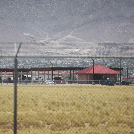 Image: Fort Bliss, which holds temporary housing for migrants is seen through a fence on June 25, 2018 in Fort Bliss, Texas.
