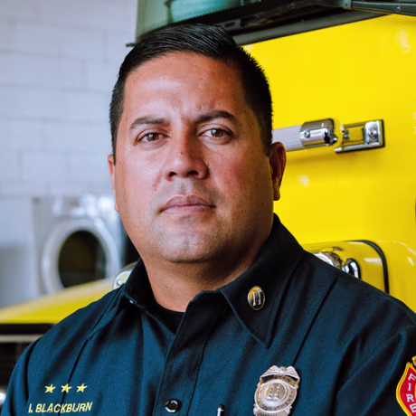 A wildfire burns in Lahaina, Hawaii on Aug. 8, 2023, and Capt. Ikaika Blackburn at Napili Fire Station in Lahaina.