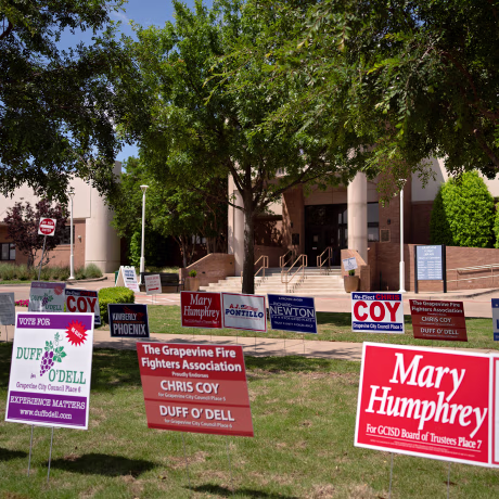 On April 29, 2023, in Grapevine, Texas, signs of GCISD candidates outside Grapevine Library where people are casting their votes.