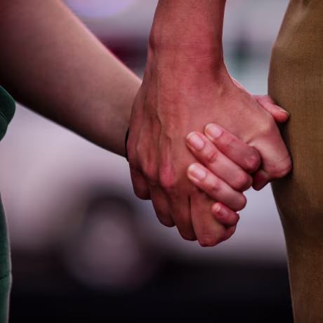 Karinina Quimpo, left, holds hands with Chris Lebron during a vigil for Julio Ramirez on June 8, 2022, in New York. Quimpo was friends with Ramirez for a decade until his untimely death  on April 21, 2022, following a night out with friends.