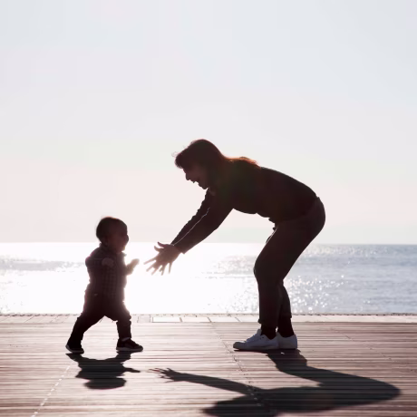 mother and baby relaxed at seaside terrace