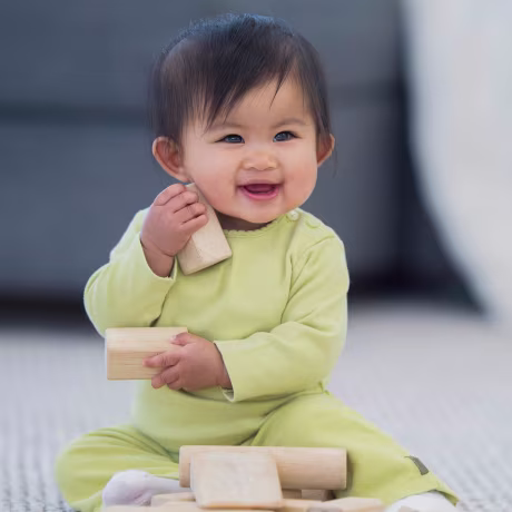 Happily Playing with Wood Blocks
