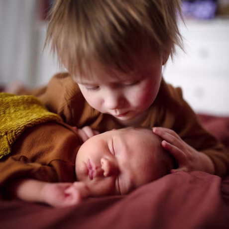 Newborn baby with older brother