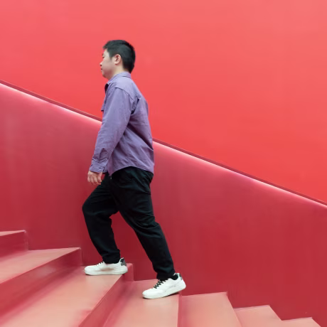 Man walking up stairs