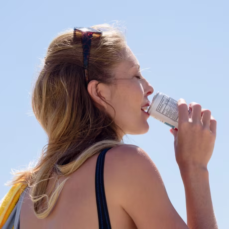Beautiful woman enjoying cold drink