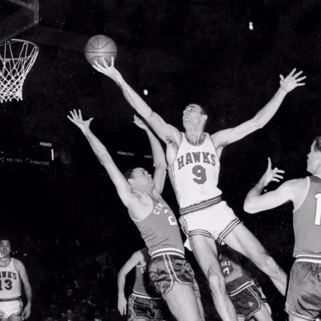 A black and white photo of on-court action during an NBA game.