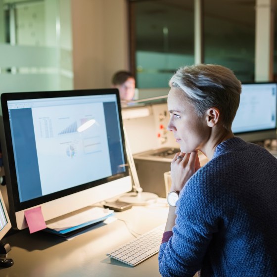 Cropped Image Businessmen Pointing At Graph In Office
